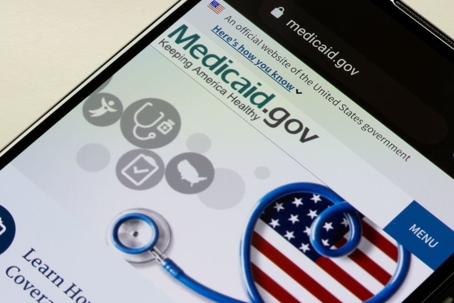 closeup of the homepage of Medicaid site on a smartphone