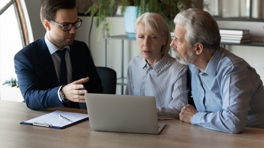 person explaining to couple