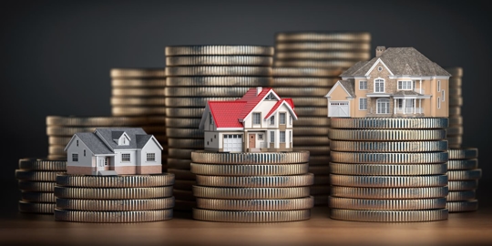 Houses of different size with different value on stacks of coins. Concept of property, mortgage and real estate investment.