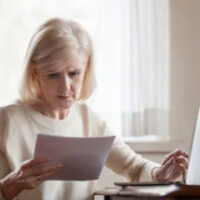 woman reading paperwork