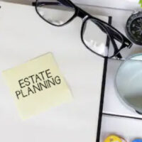 estate planning written on a sticky note