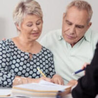 elders signing paperwork