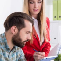 woman signing paperwork